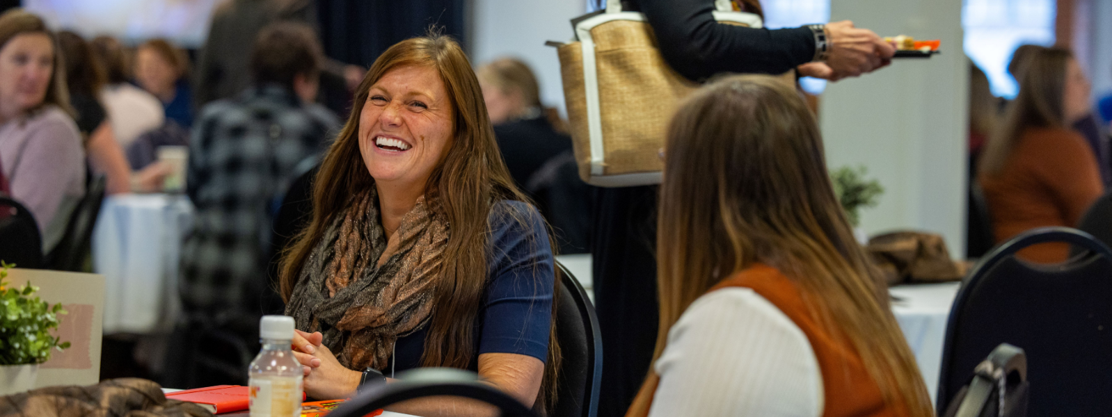 Woman Laughing at Conference