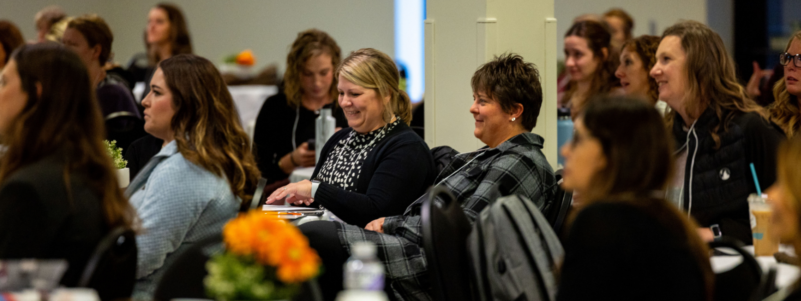 Women Smiling at Conference